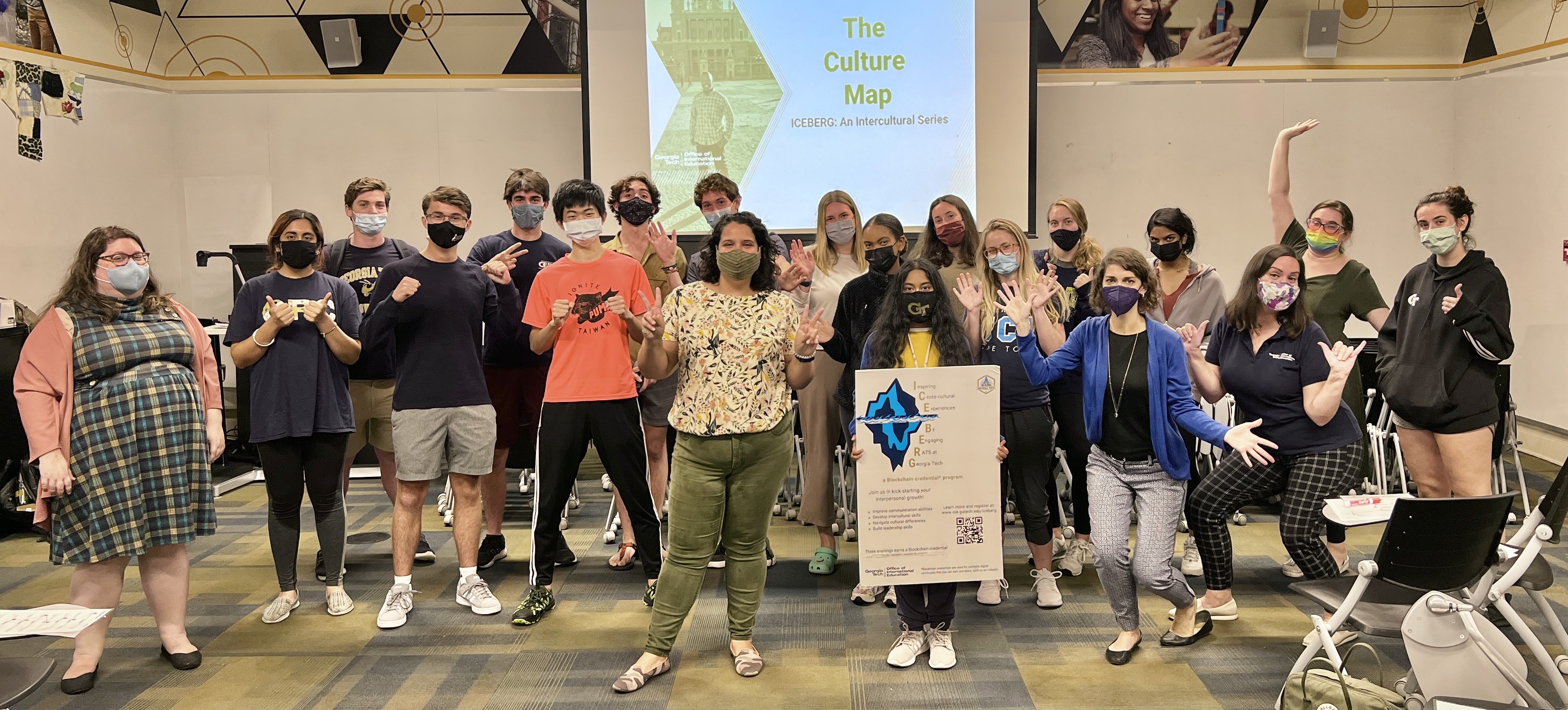 A large group of Georgia Tech students and staff wearing masks who participated in ICEBERG face the camera at the conclusion of their third workshop.